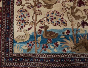 A RUG, a semi-antique Esfahan probably, figural, ca 214,5 x 137,5 cm.