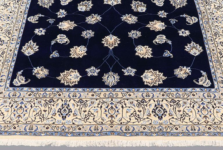 A carpet, Nain part silk s.k 9LAA, ca 312 x 199 cm.