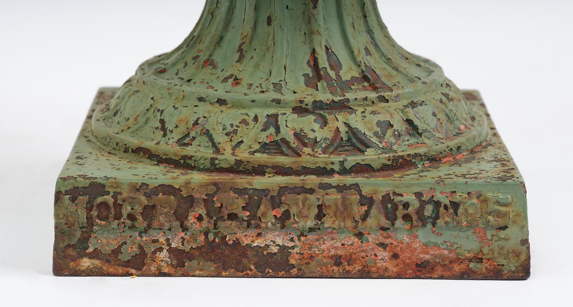 A green-painted cast-iron urn from Norrahammars bruk, Sweden, late 19th century.