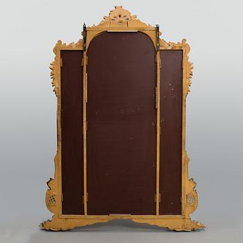 A late 19th century mirror in rococo style.