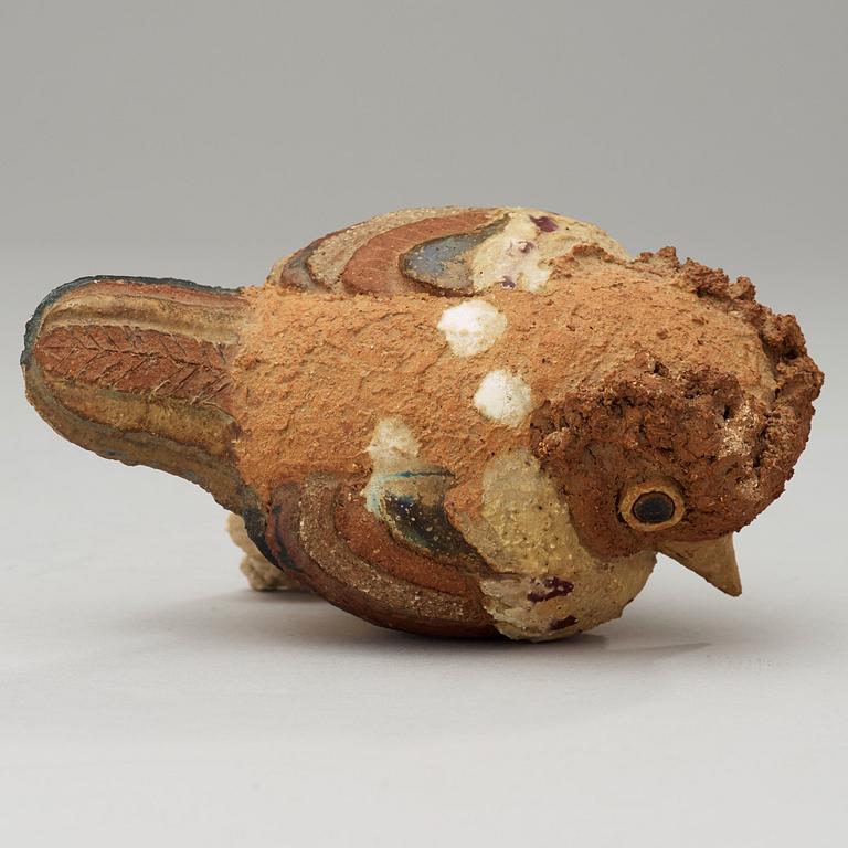 A Tyra Lundgren stoneware sculpture of a bird.