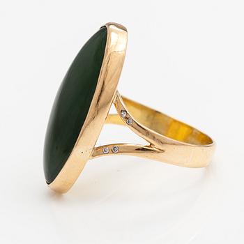 An 18K gold ring witha nefrite and diamonds ca. 0.01 ct in total. Lagercrantz Jewellery, Tammisaari 2005.