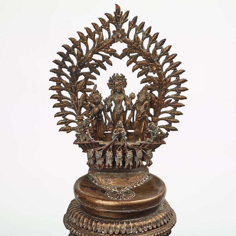 A copper alloy temple lamp, Nepal, circa 1900.