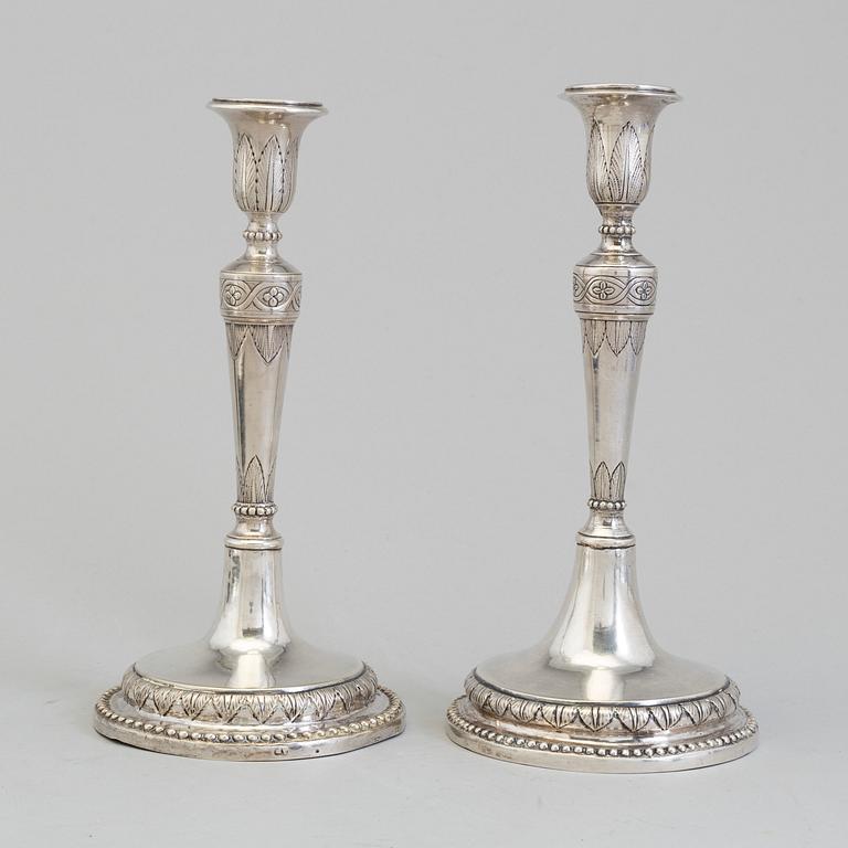 A pair of Italian early 19th century candlesticks, mark of Naples 1804.