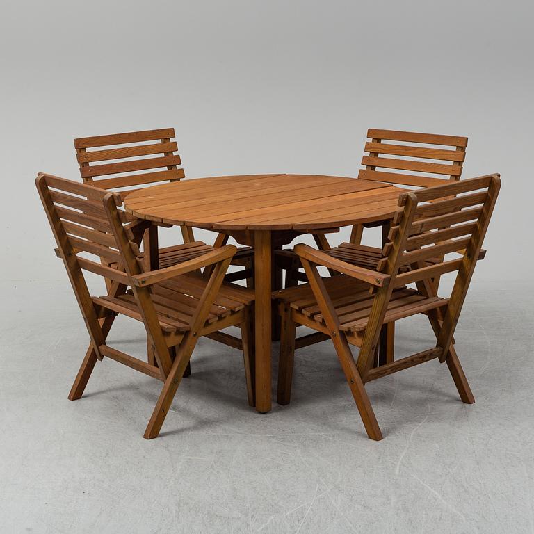 A Carl Malmsten "Bergshamra" garden table and four chairs, first half of the 20th century.