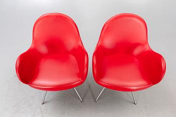 A pair of MB Sedie leather armchairs later part of the 20th century.