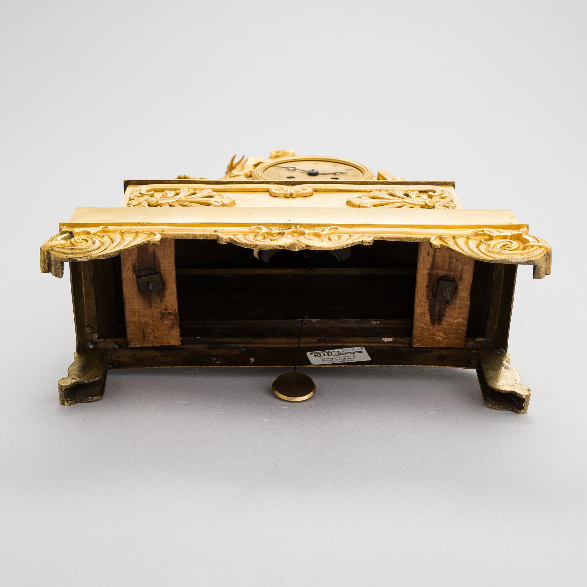 A French Empire mantel clock from 1820s-30s.