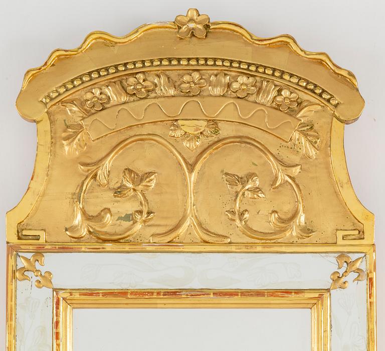 An empire style mirror, 20th century.