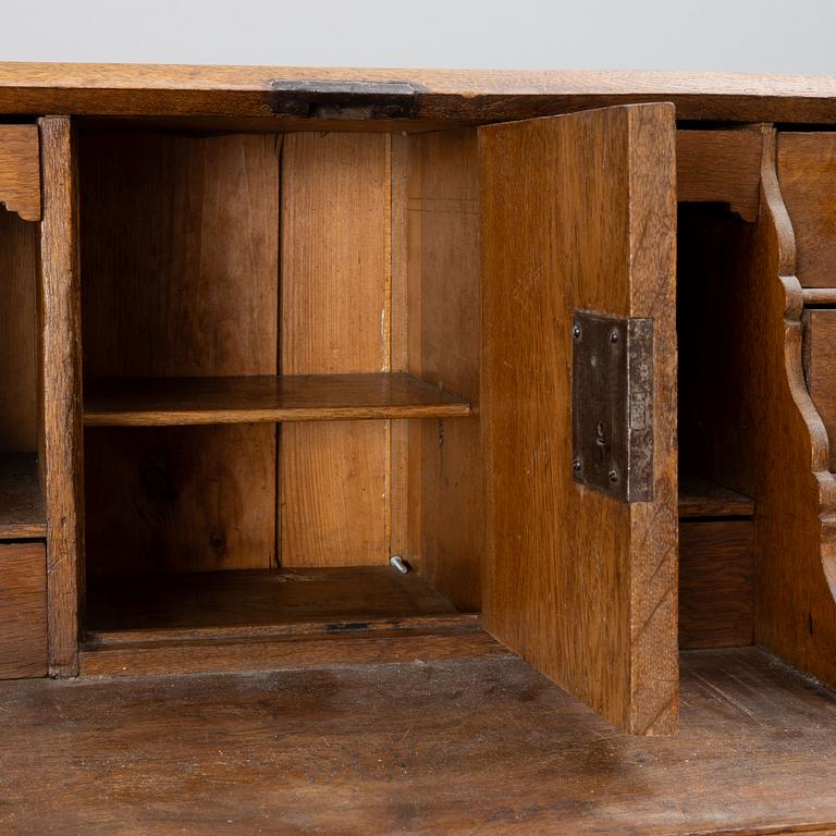 An oak secretaire, around 1800.