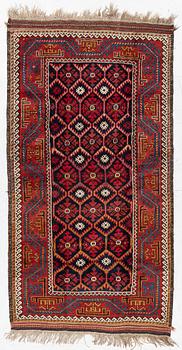 An antique Baluch rug, east Persian, ca 203 x 101 cm.
