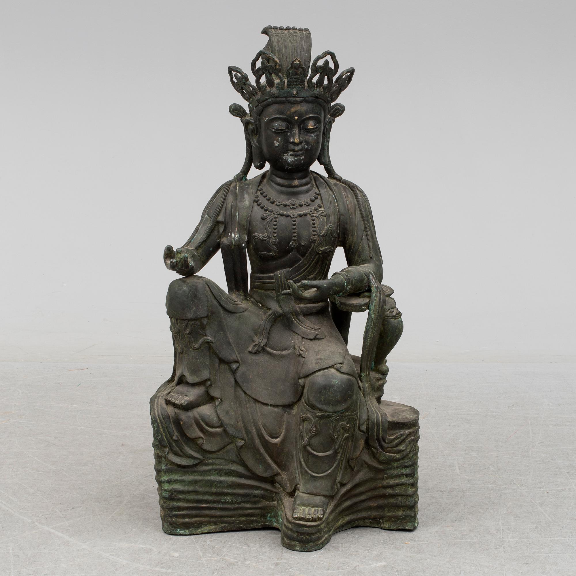 A mid 20th century metal Guan Yin figurine, China.