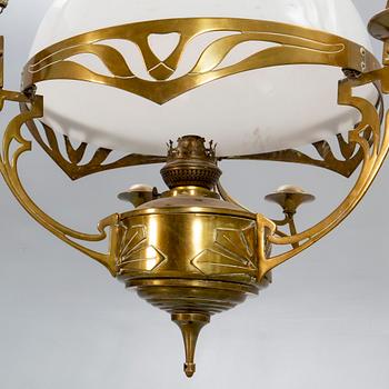 A Jugend brass celing paraffin lamp.