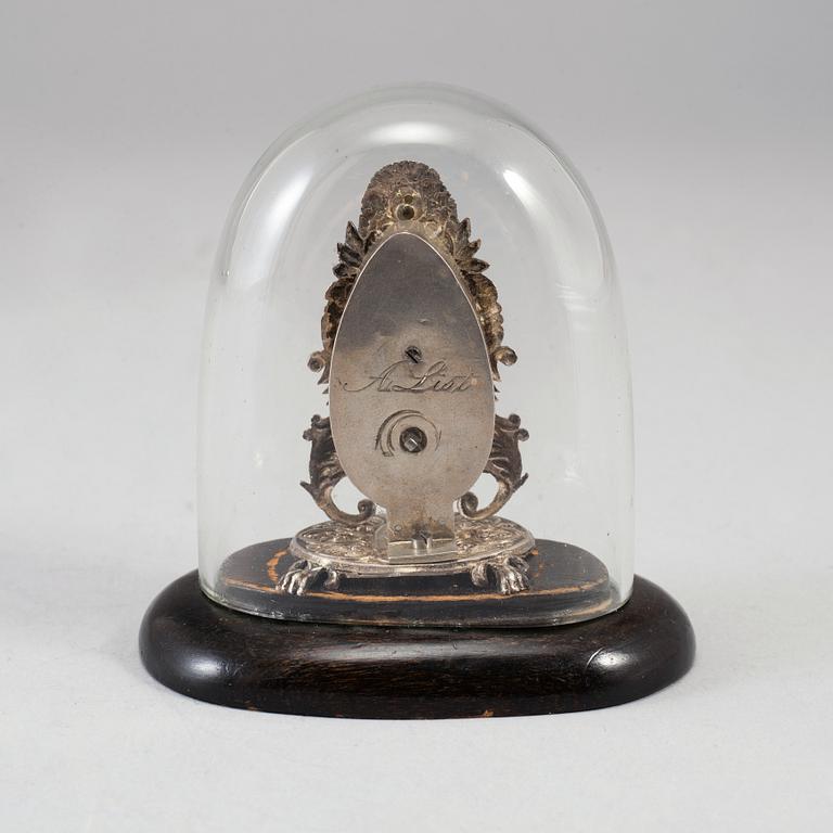 A 19th century miniature silver mantle clock.