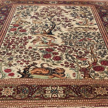 A CARPET, a semi-antique Esfahan figural, 215,5 x 140,5 cm.