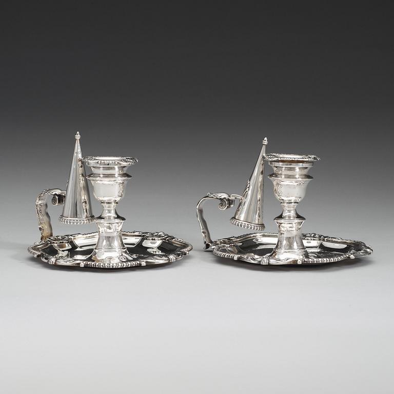 A pair of English 19th century silver chamber-candlesticks, marks of Benjamin Smith II and James Smith III, London 1808.