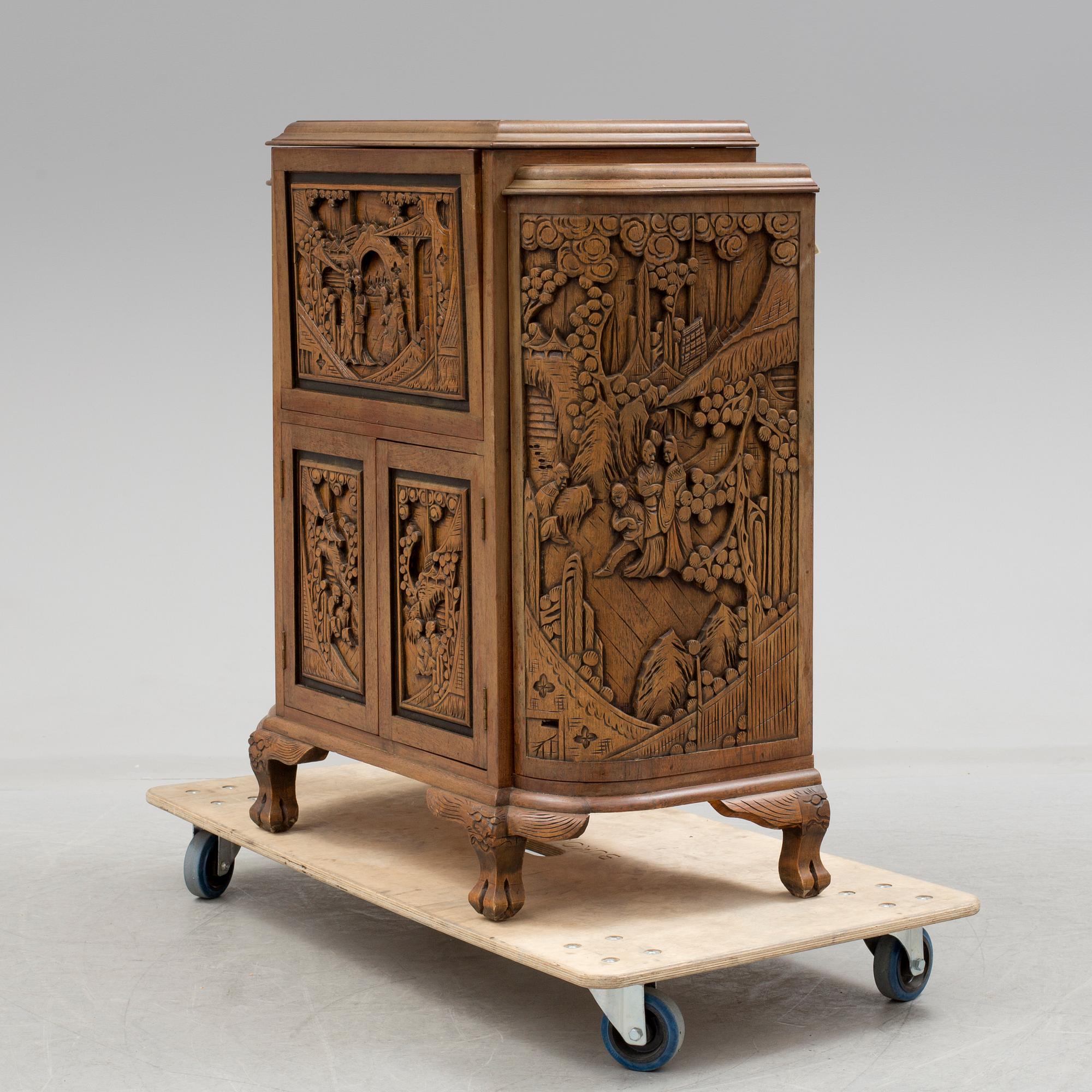 a chinese style bar cabinet from the late 20th century.
