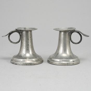 A pair of 19th century pewter candlesticks.