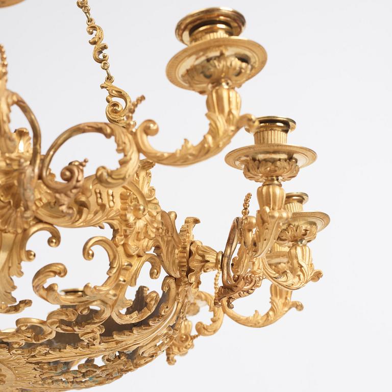 A rococo-revival gilt-brass sixteen-light chandelier, mid 19th century.