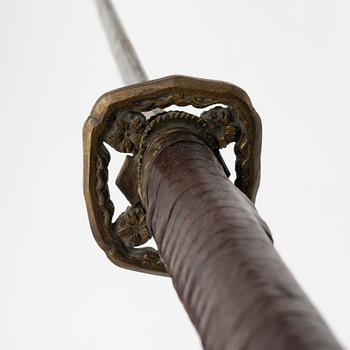 A Japanese sword, 20th century mounting.