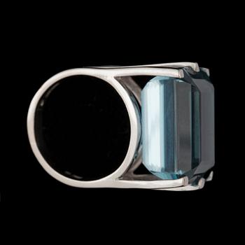 A step-cut aquamarine, 25.13 cts, ring.
