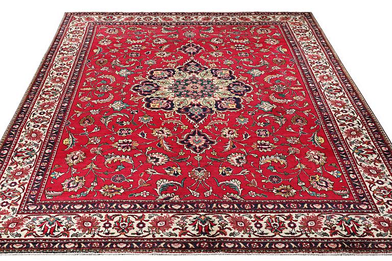 A Tabriz carpet, c. 385 x 300 cm.