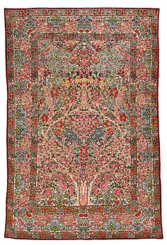 296. A RUG, a semi-antique Kerman "mille-fleur", ca 198,5 x 136,5 cm.