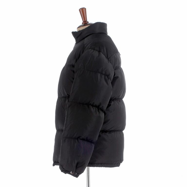 PRADA, a black down jacket, size 48.