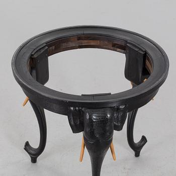 An early 20th Century smoking table, wood and copper.