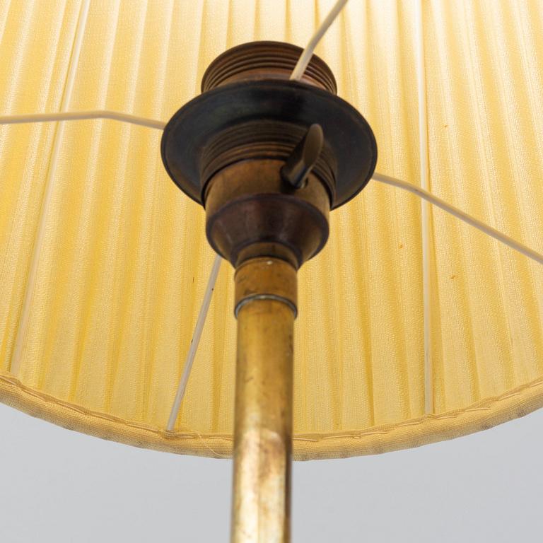 A 1940's brass floor lamp by Harald Elof Notini for Böhlmarks, Sweden 1940's, model 15390.