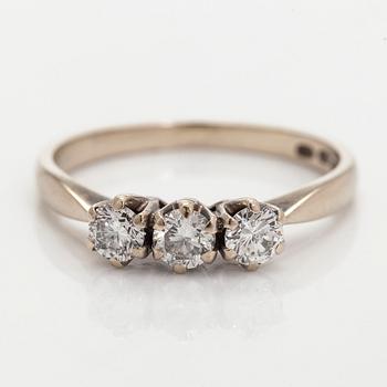 Ring, three brilliant cut diamonds, 18K white gold, H. Lahtinen & Co., 1985.