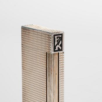 S.T. Dupont, a late 20th century table lighter.