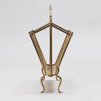 A folding brass magazine stand, first half of the 20th century.