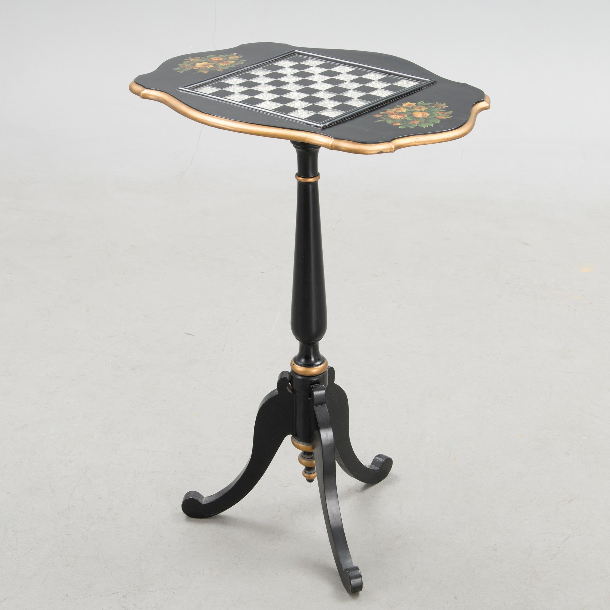 A Chinese tilt top chess table from the first half of the 20th century.