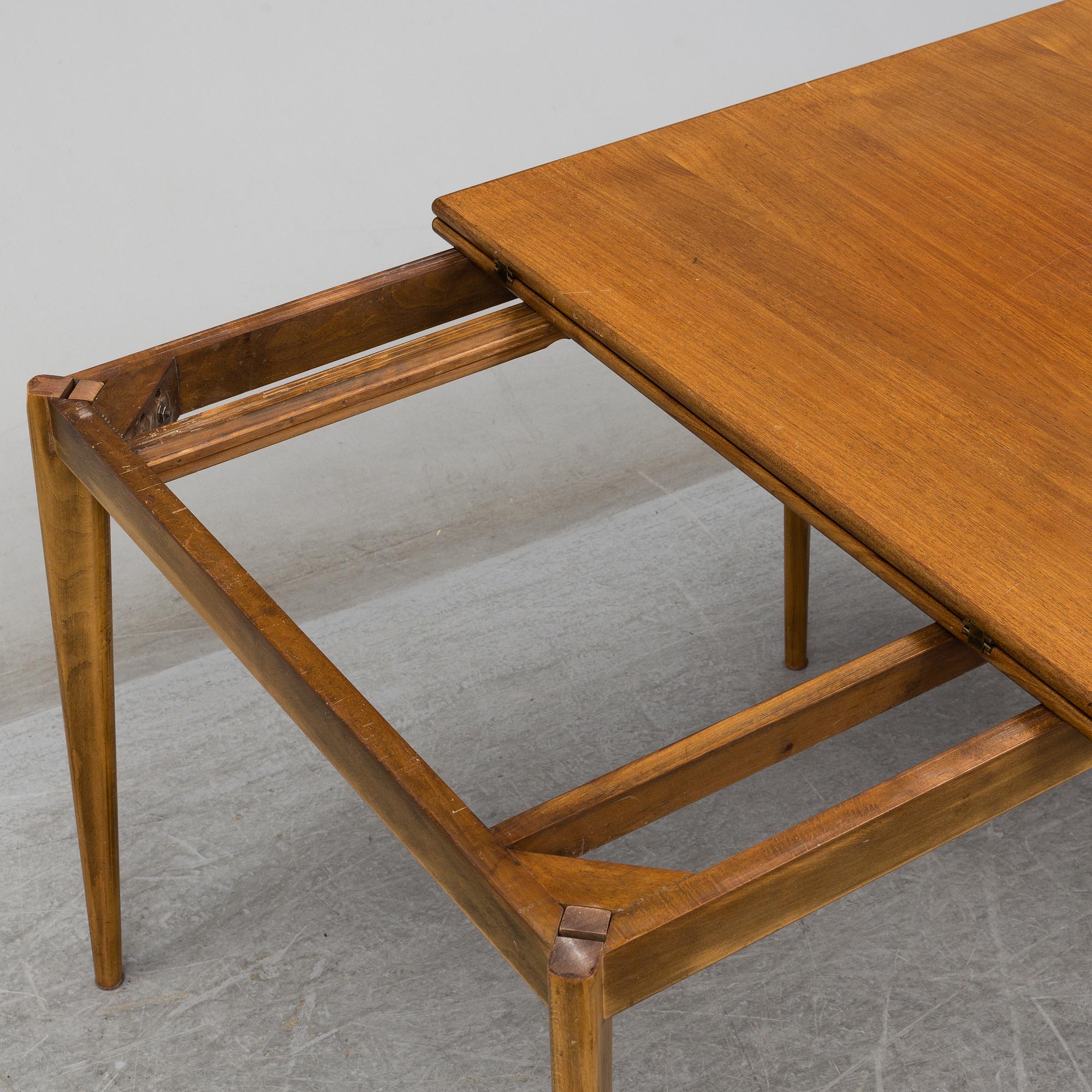 Four '829' chairs by Karl Axel Adolfsson, Gemla with an additional table.