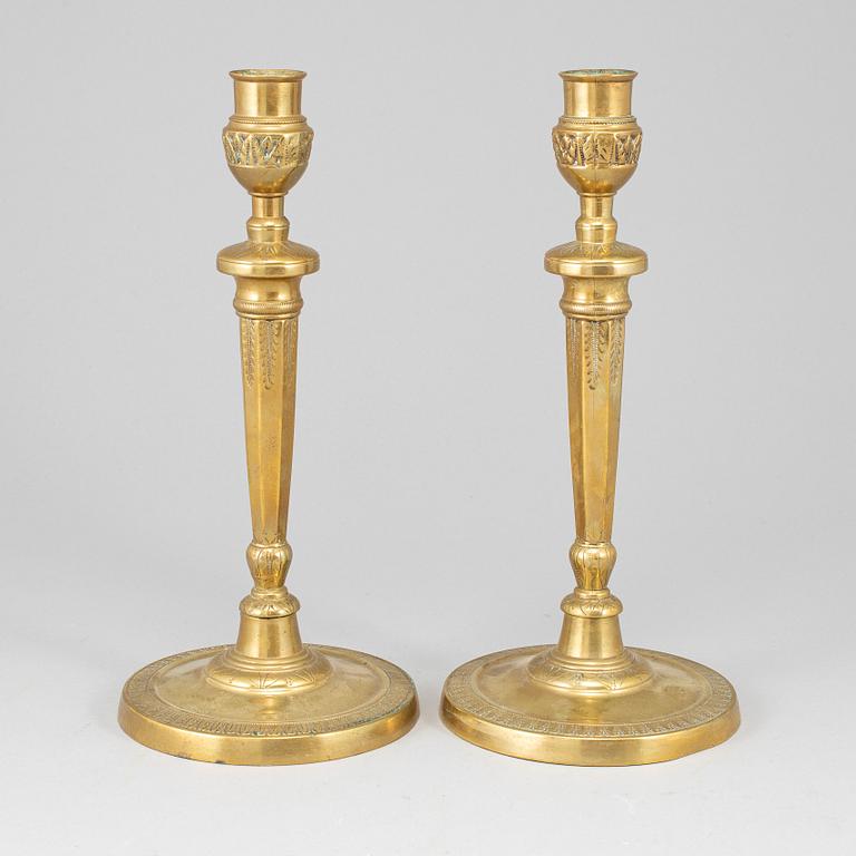 A pair of late 18th century bronze candlesticks.