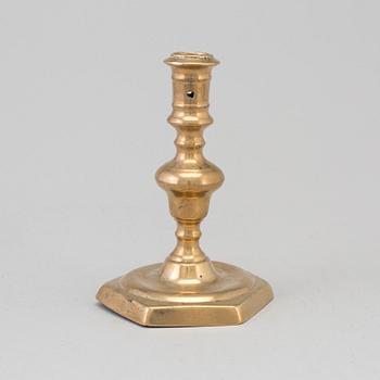 A 17th century bronze candlestick.