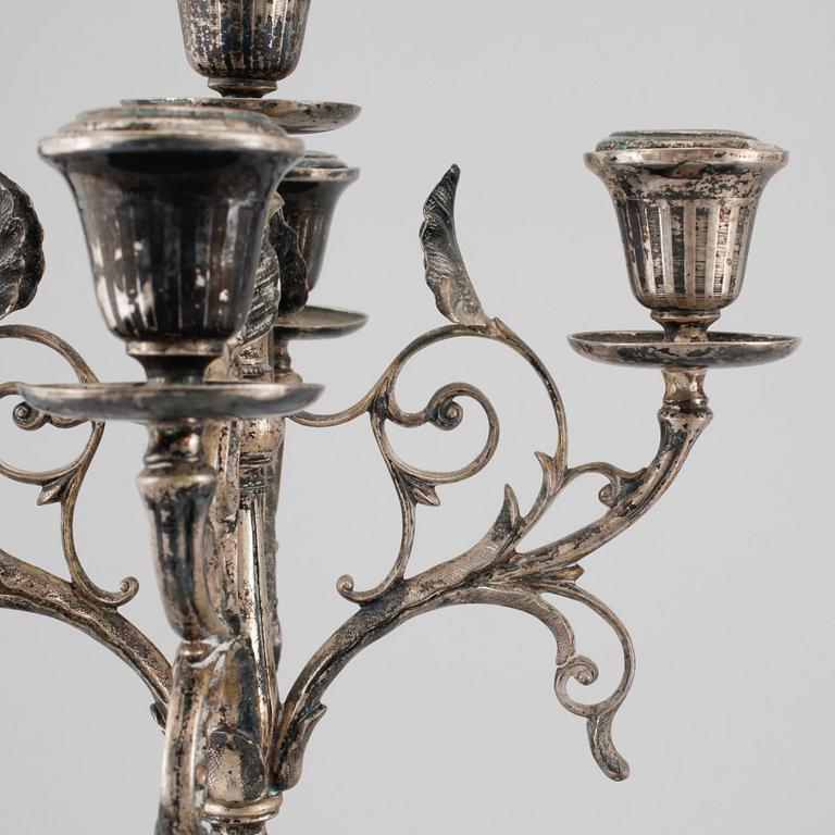 A pair of silver candelabras by Gustaf Möllenborg 1823-1850 (1930), Stockholm, 1875.