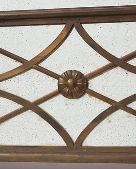 Swedish Grace, a brass framed wall mirror, 1920-30s.