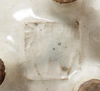 A pale grey-bluish glazed tripod censer with decor in relief, and archaistic mark, Ming dynasty (1368-1644).