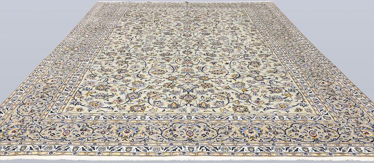 A Keshan carpet, signed, 397 x 302 cm.