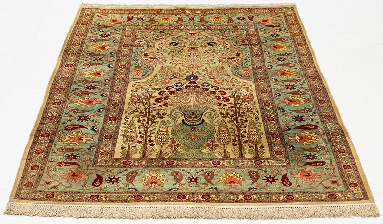 A rug, semi-antique, silke Hereke, ca 185 x 122 cm.