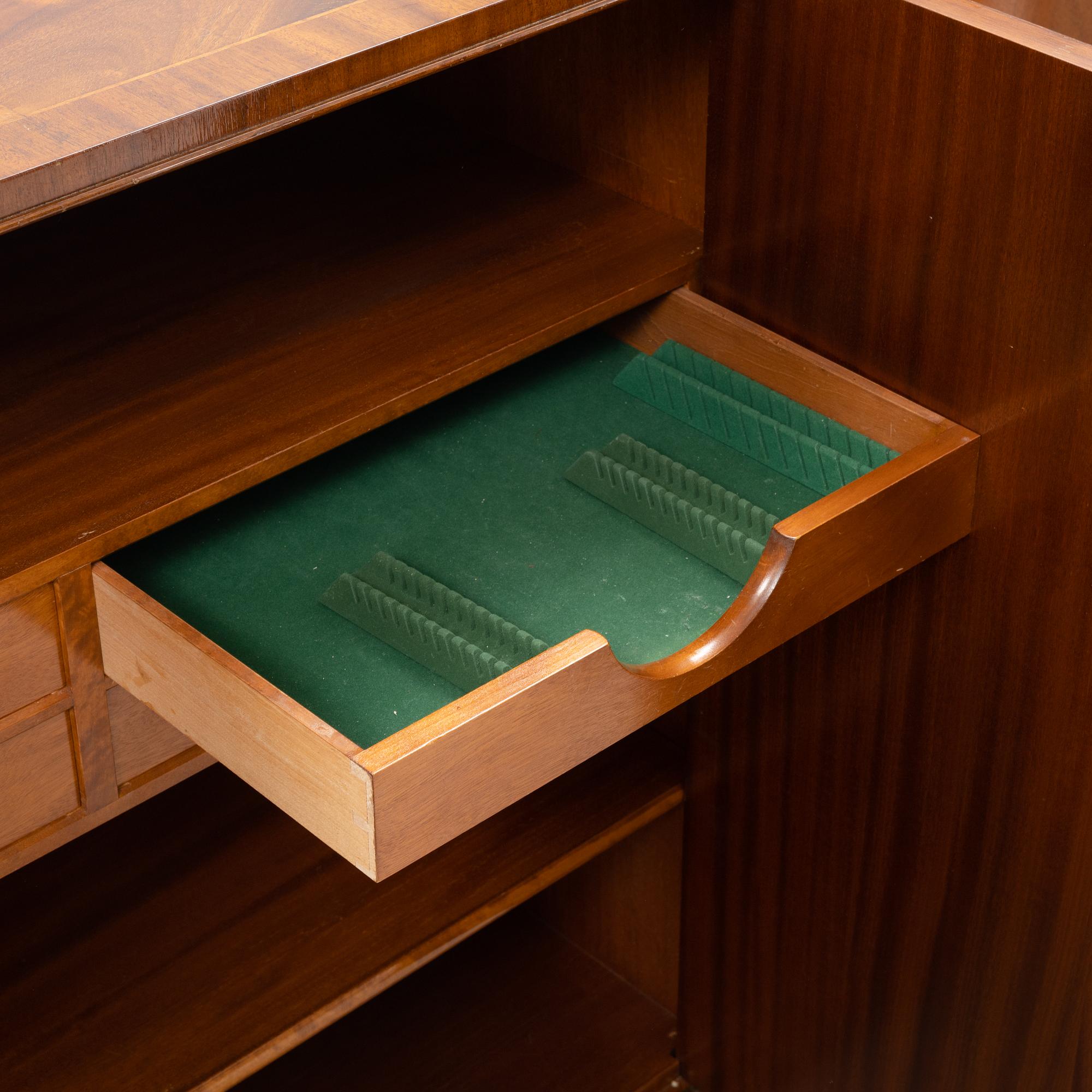 A 1940s mahogany veneered cabinet.