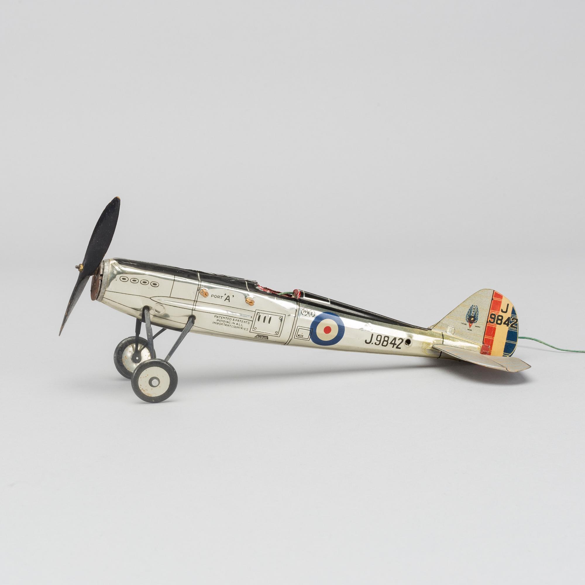 A COLLECTION OF MECHANICAL TIN TOYS, ONE  Frog Interceptor Fighter  Mark IV" England 1930'S.