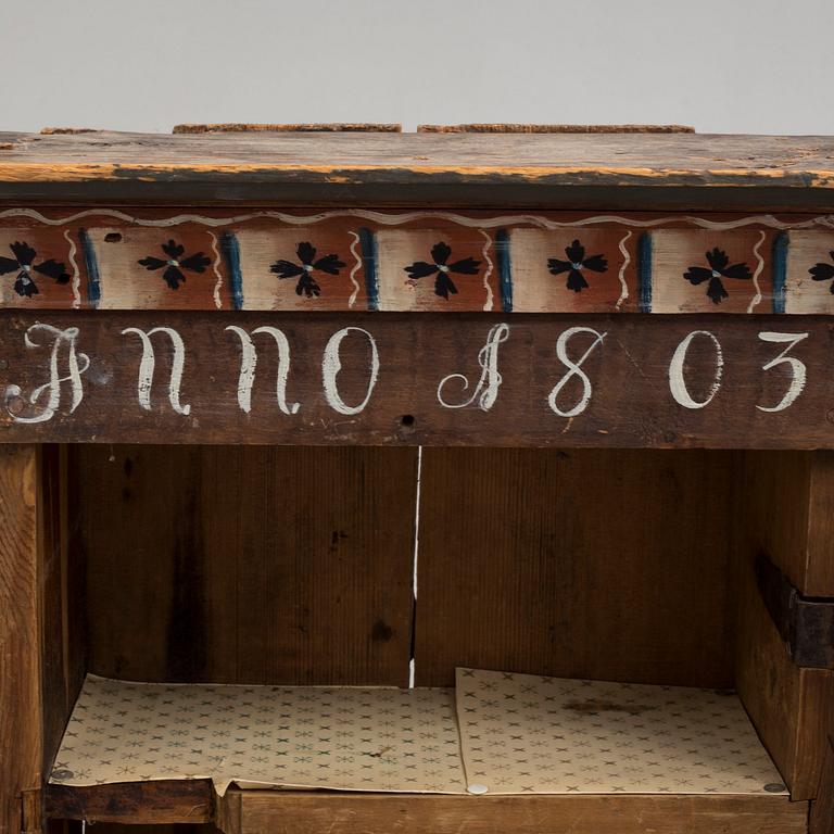 An early 19th century wall cabinet.