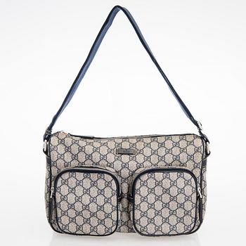 Gucci, A "GG Supreme messenger" bag.