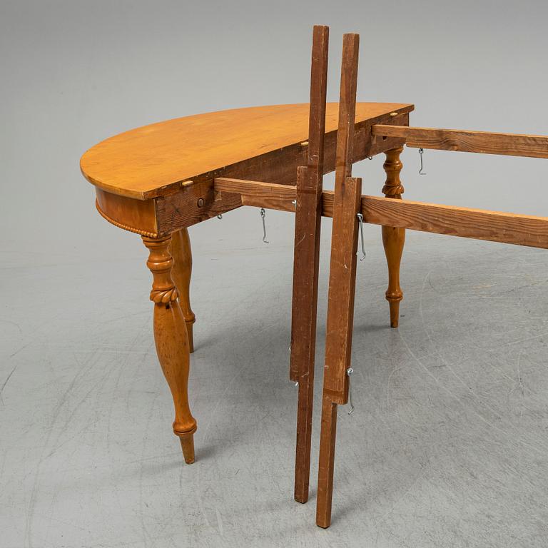 A mid 19th century birch dining table.