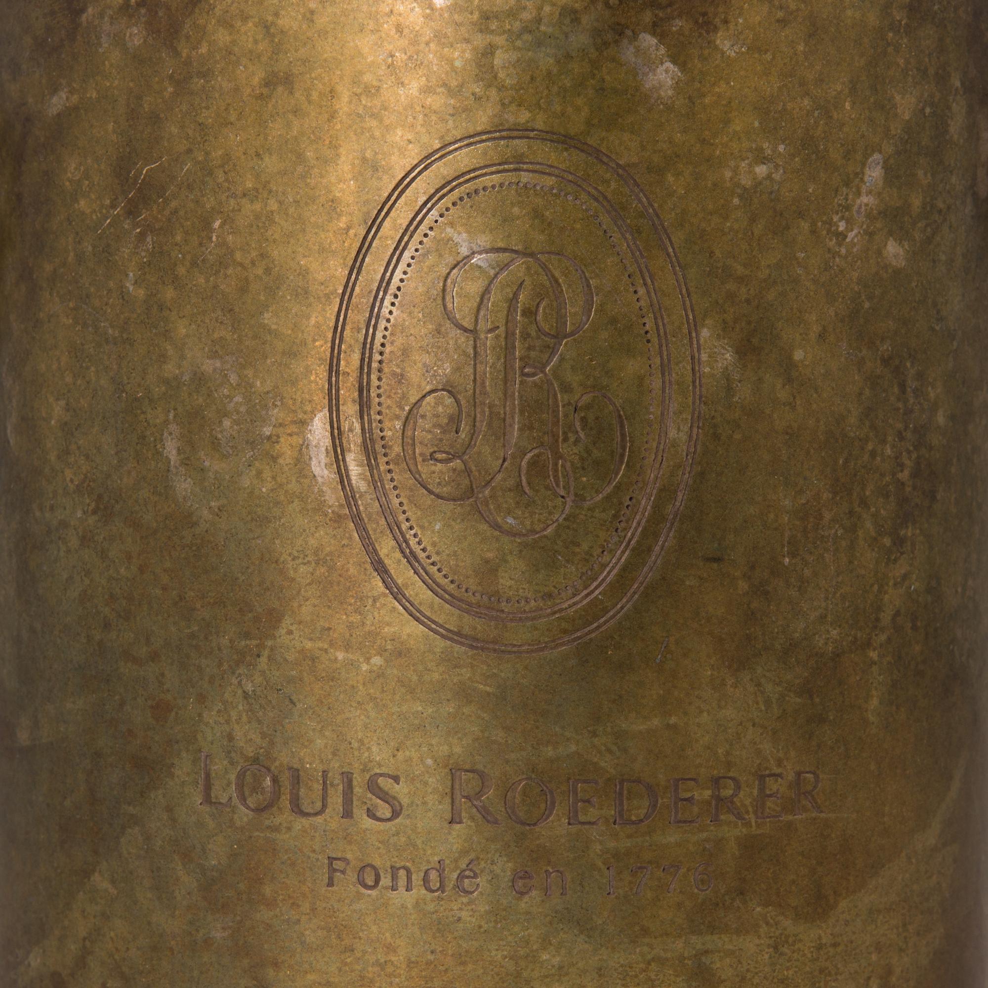 A Louis Roederer champagne cooler of silver plated brass.