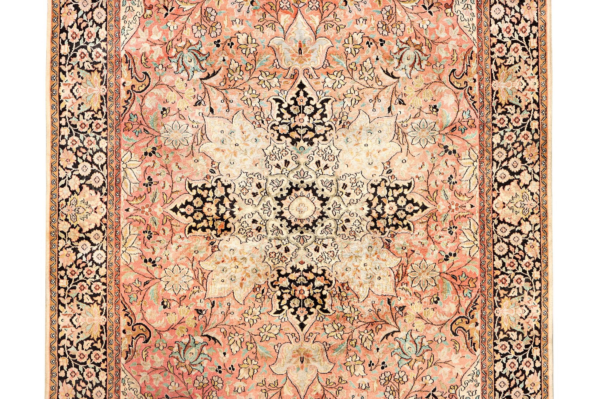 A silk Kashmar carpet, c. 280 x 177 cm.