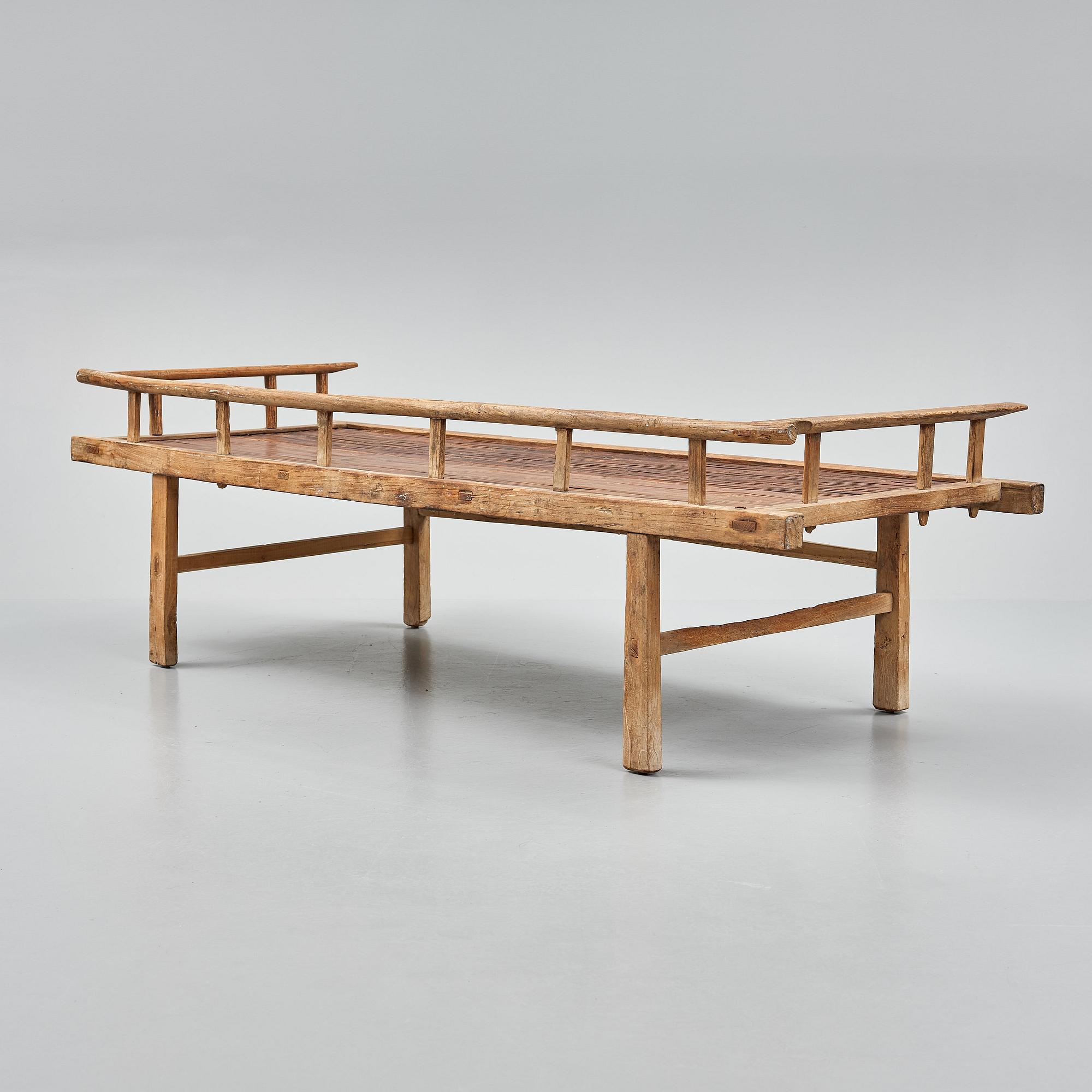 A wooden daybed, South East Asia.