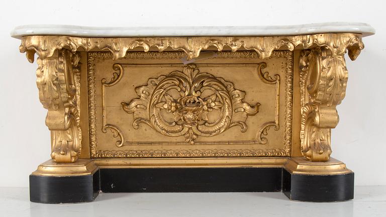 A late 19th century console table with a marble top.